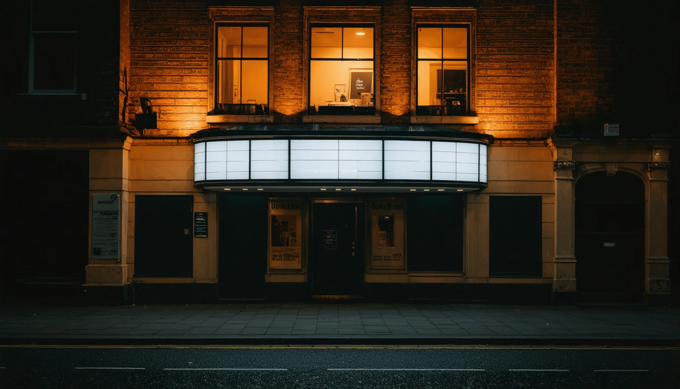 The illuminated exterior of an independent cinema on a dark evening in a UK city centre
